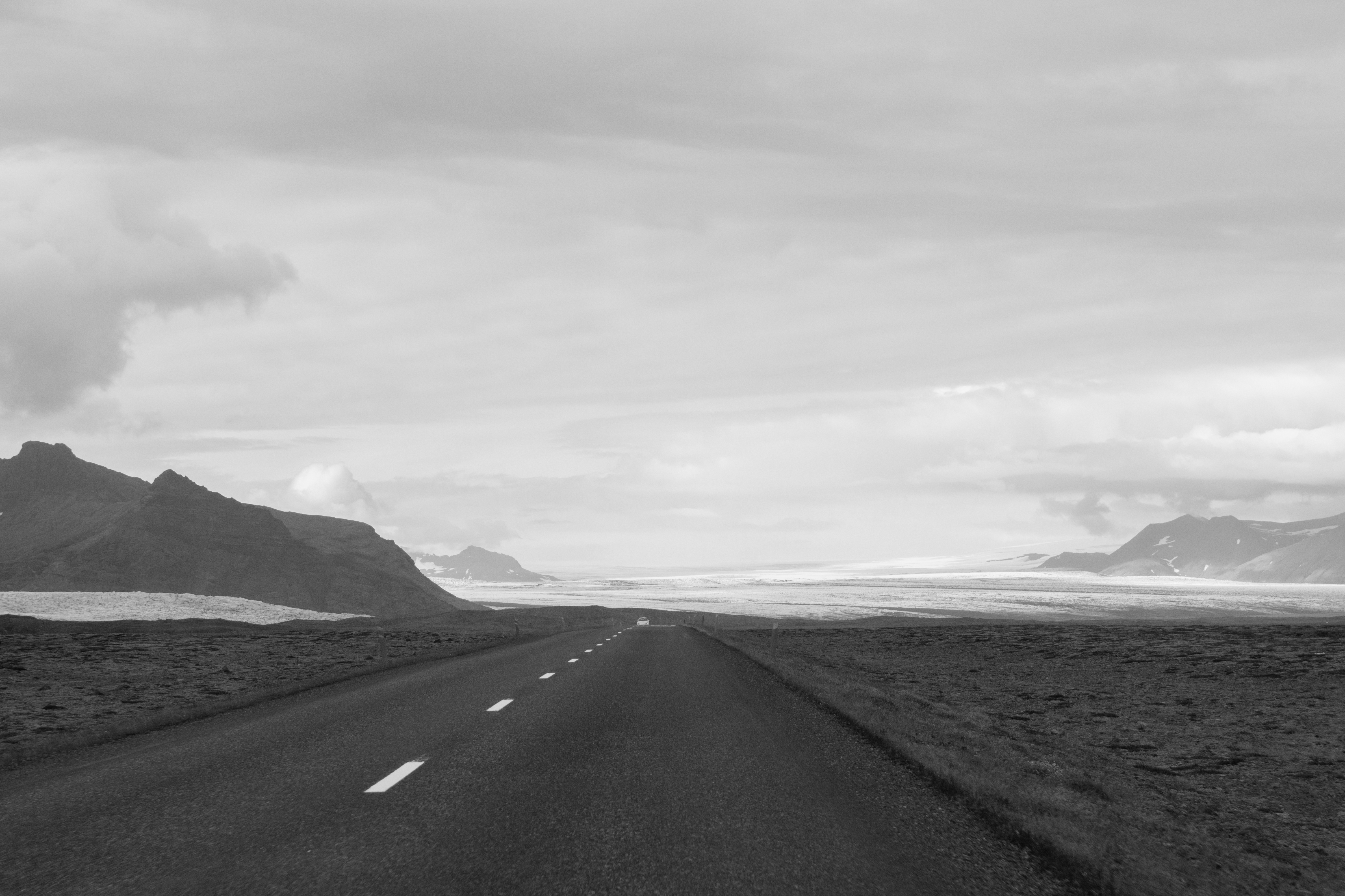 empty-road-amidst-landscape-against-sky - Bidaya Global